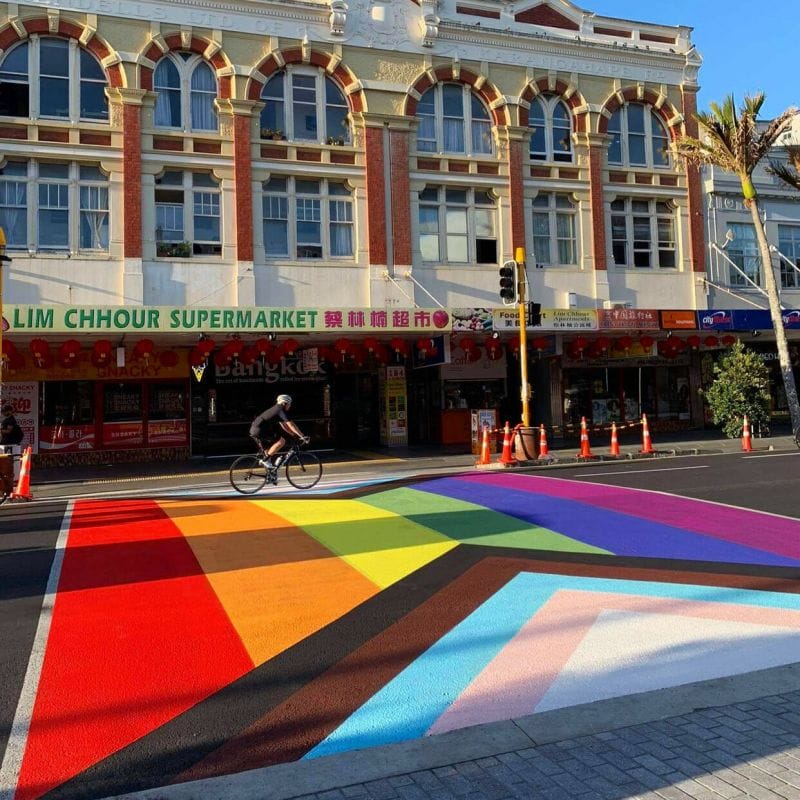 Colorful Pride crossing on Karangahape Road, Auckland, symbolizing inclusivity and LGBTQ+ pride.